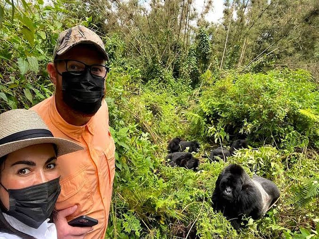 Tourists enjoying gorilla trekking in Volcanoes National Park, Rwanda