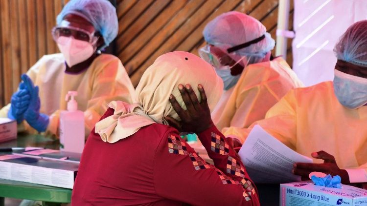 Health workers wearing personal protective equipment like masks as one of the control measures.