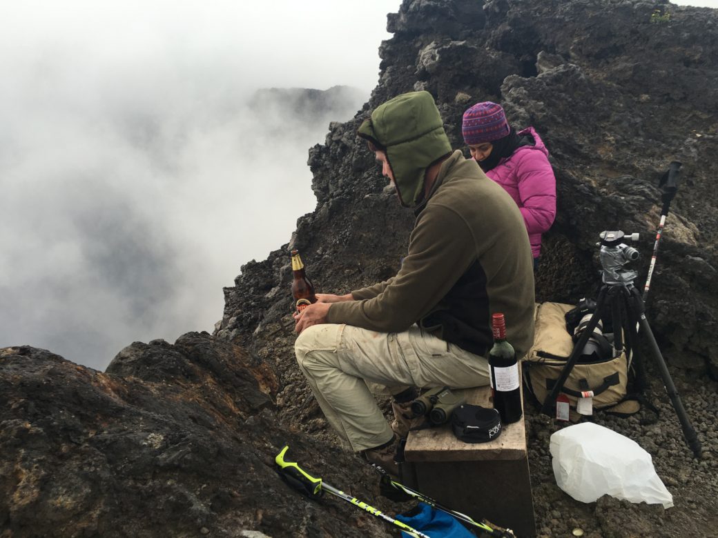 Tourists on top of Mountain Nyiragongo on their hiking trip in Congo.