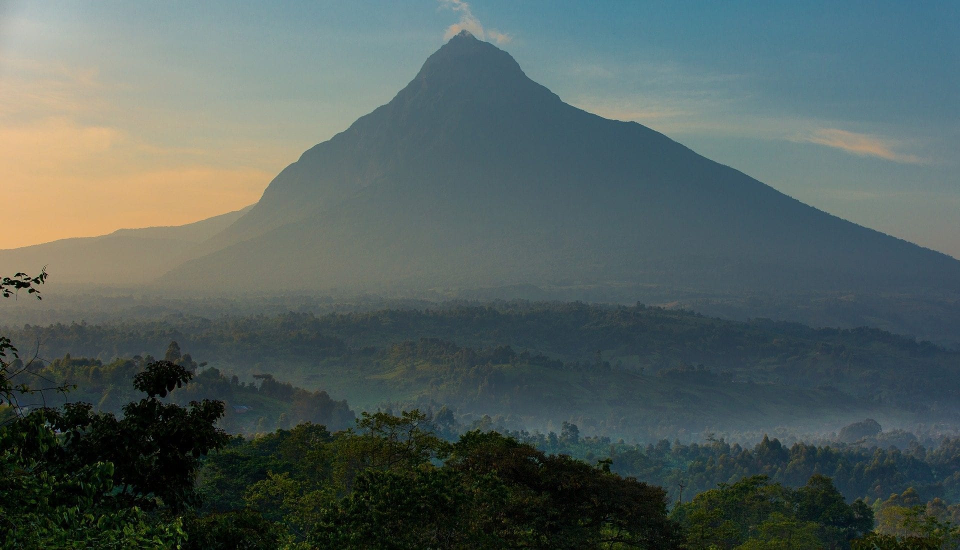 Virunga National Park, located in the eastern part of the Democratic Republic of the Congo (DRC), is one of Africa's most iconic and biodiverse protected areas. A UNESCO World Heritage Site, Virunga spans over 7,800 square kilometers and is home to a stunning variety of landscapes, from savannas to rainforests and active volcanoes. The park is best known for being the habitat of the mountain gorillas, one of the world’s most endangered species, with efforts in Virunga playing a crucial role in their conservation.Visitors can embark on gorilla trekking to observe these magnificent creatures in their natural habitat, an unforgettable experience. Pieland Gorilla Safaris specializes in organizing such trips, providing expert guides and ensuring a seamless, safe trekking experience. In addition to the gorillas, Virunga offers incredible wildlife encounters, including forest elephants, chimpanzees, and a wide array of bird species. The park is also famous for Mount Nyiragongo, an active volcano that boasts one of the largest lava lakes in the world, offering adventurous hikers a truly unique experience. Virunga’s rich cultural heritage, local tribes, and its conservation efforts make it a must-visit destination for travelers seeking adventure and wildlife encounters in Africa.