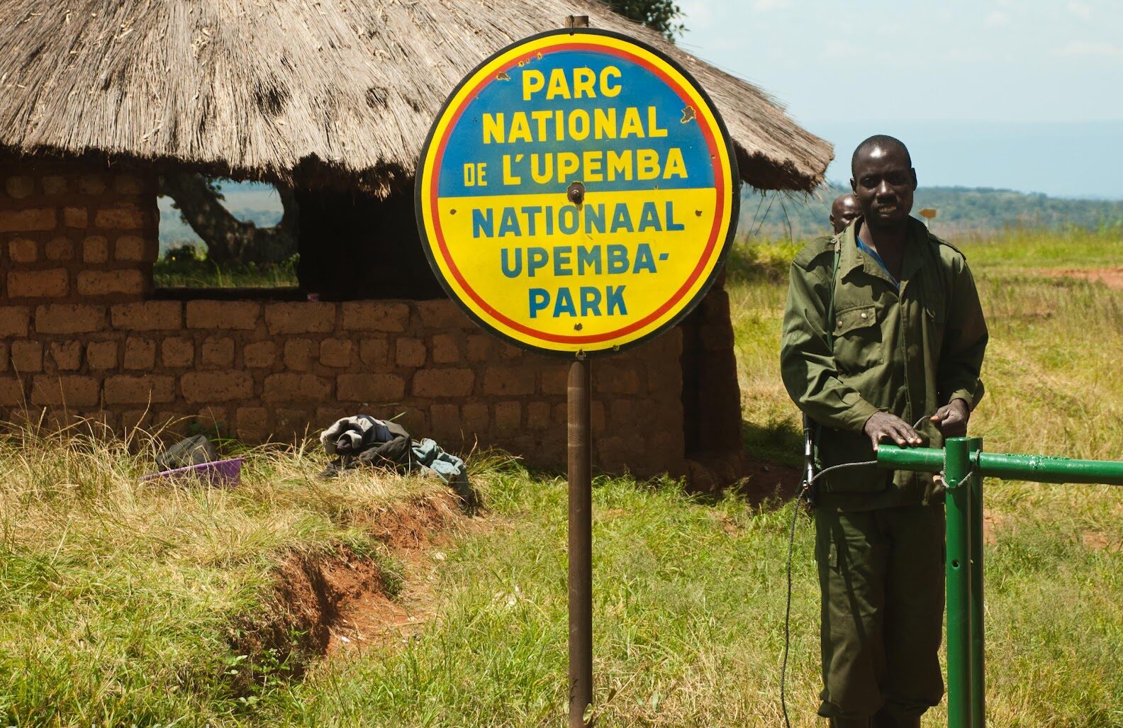 A ranger stands at the entrance of Upemba National Park.