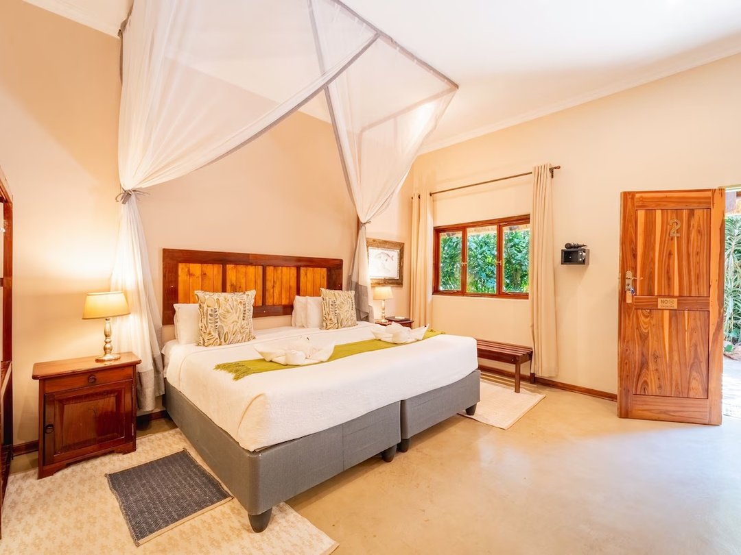 Bayete Guest Lodge is a comfortable mid-range accommodation option and one of the best lodges in Victoria Falls for travelers seeking good value, a relaxed atmosphere, and convenient access to local attractions. Set within attractive tropical gardens, the lodge offers comfortable rooms, a swimming pool, welcoming communal spaces, and a peaceful environment after a day of sightseeing. Guests can easily combine their stay with guided Victoria Falls tours, Zambezi River cruises, adventure activities, and onward trips to Chobe National Park. Bayete is especially suitable for couples, families, and travelers looking for reliable comfort without the higher cost of luxury accommodation.