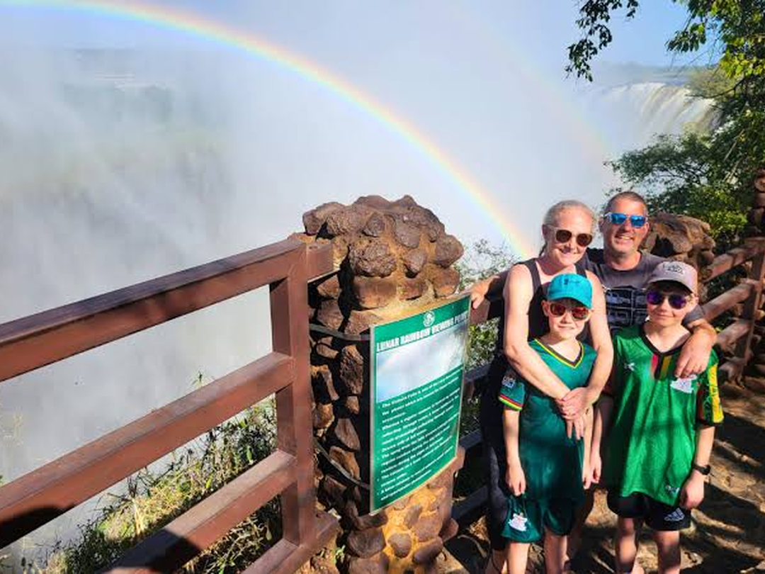 A family enjoys some of the best views of Victoria Falls during a memorable trip organized by the Best Victoria Falls Safari Company. Standing together at the scenic viewpoints, they admire the powerful waterfalls, rising mist, lush rainforest, and dramatic Batoka Gorge while capturing beautiful family photographs. The experience gives both adults and children the chance to appreciate one of Africa’s most spectacular natural attractions in a relaxed and enjoyable way. With carefully planned activities, comfortable transfers, and professional guiding, the family can explore Victoria Falls safely while creating lasting memories of their Southern African journey together.