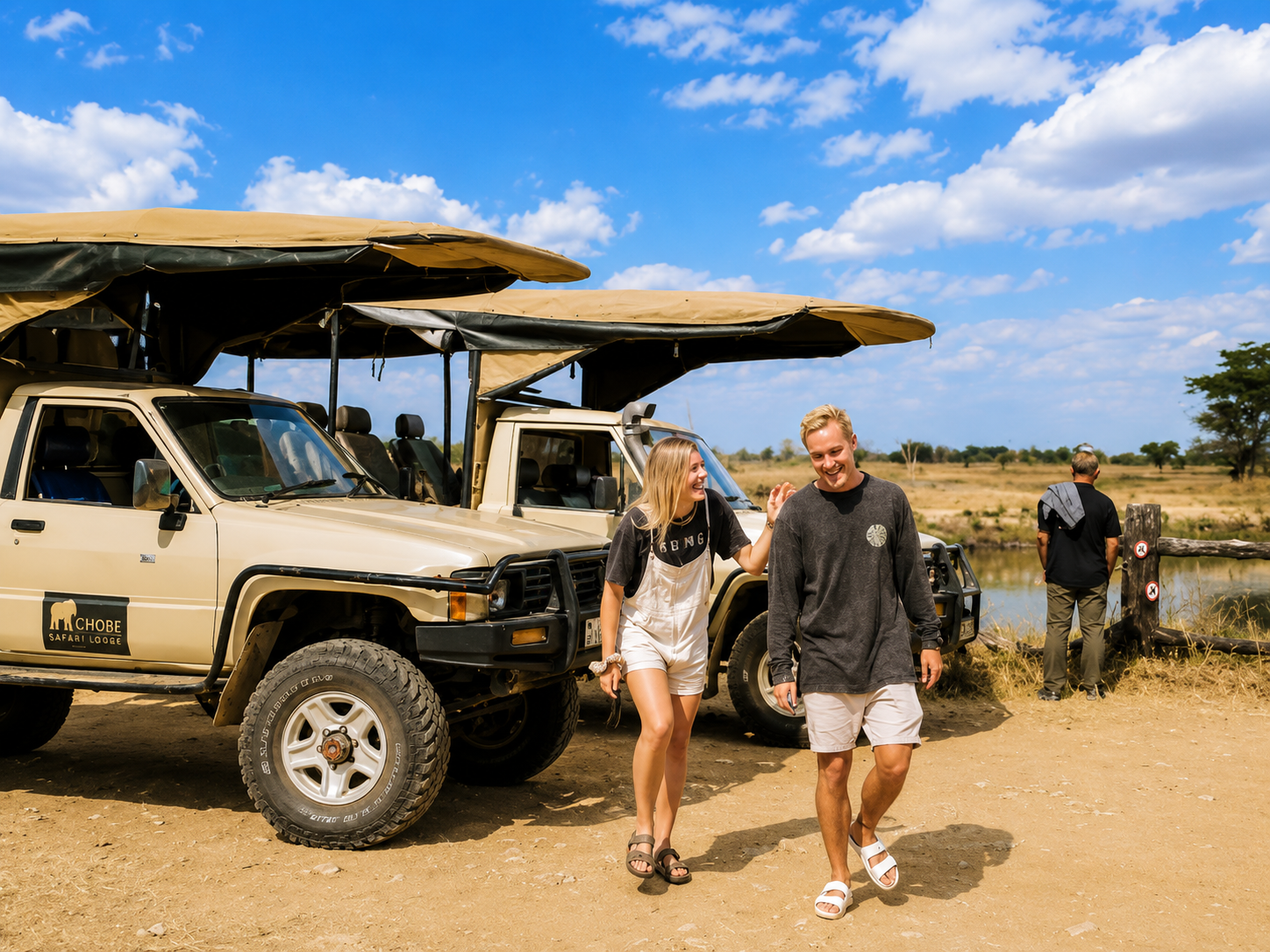 Tourists travelling by safari vehicle from the Okavango Delta to Victoria Falls