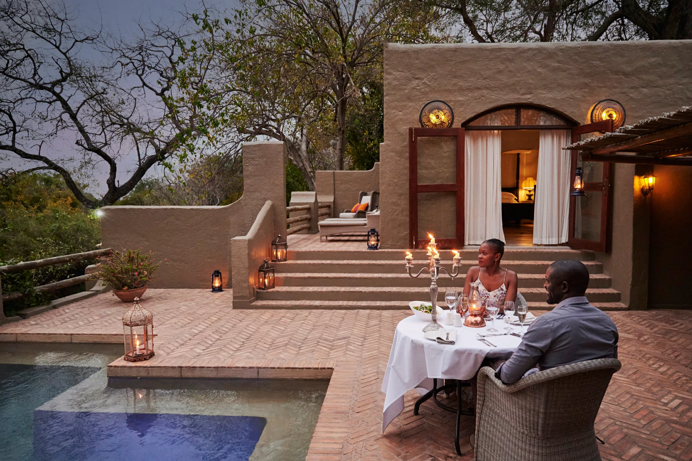 A couple enjoying their honeymoon at Chobe Game Lodge, organized by Pieland Gorilla Safaris, experiences a romantic combination of luxury, wildlife and beautiful river scenery. Their stay includes relaxing moments overlooking the Chobe River, exciting game drives and peaceful boat safaris where elephants, hippos, crocodiles and colorful birds may be seen. Evenings offer opportunities for romantic dinners and spectacular sunsets after rewarding wildlife encounters. Pieland Gorilla Safaris organizes the honeymoon to ensure smooth transfers, carefully selected activities and a comfortable safari experience, making Chobe National Park a wonderful destination for couples celebrating their honeymoon in Botswana.