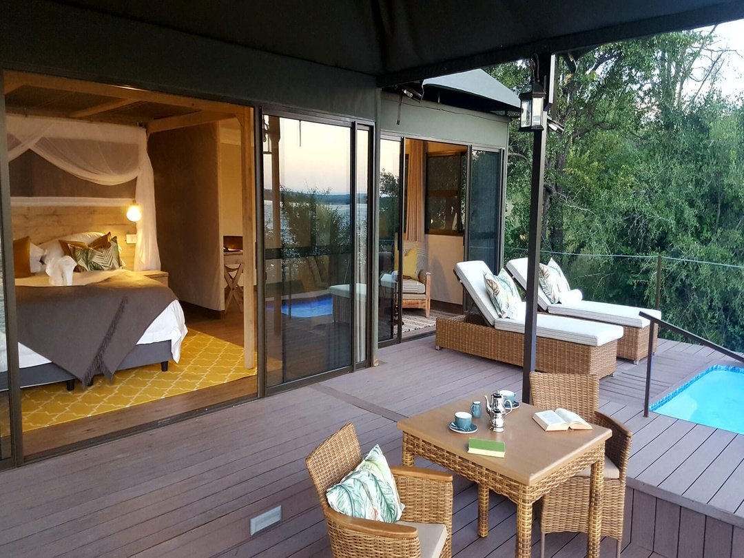 Old Drift Lodge is a luxury honeymoon lodge at Victoria Falls, offering couples a romantic and unforgettable safari escape on the banks of the Zambezi River. Located within Zambezi National Park, the lodge features elegant private suites, plunge pools, stunning river views, and intimate experiences surrounded by nature. Honeymooners enjoy activities such as sunset cruises, game drives, and guided visits to Victoria Falls while celebrating their love in a peaceful African wilderness setting.