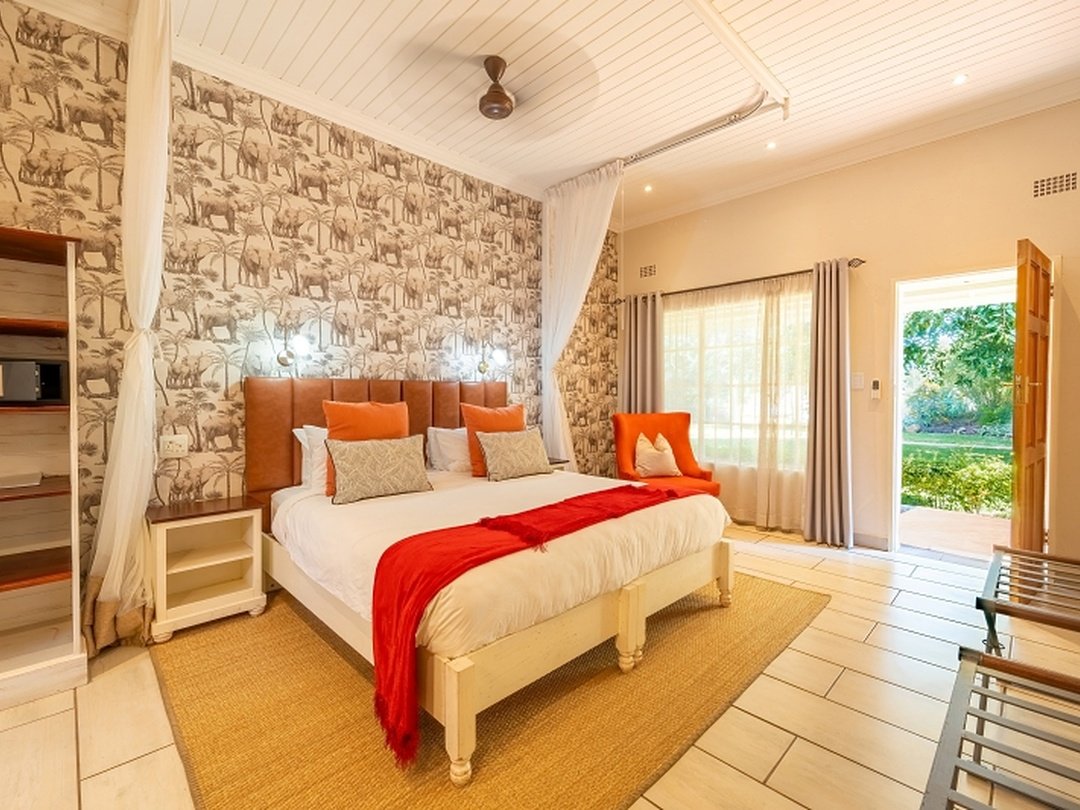 Pioneers Victoria Falls is an excellent mid-range accommodation choice for couples visiting Victoria Falls who want comfort, good value, and a peaceful setting. Located in a quiet residential area, the lodge offers spacious rooms, attractive gardens, swimming pools, comfortable communal spaces, and a relaxed atmosphere that suits romantic stays. Couples can enjoy guided Victoria Falls tours, Zambezi River cruises, adventure activities, and easy access to nearby restaurants and attractions. Pioneers is especially suitable for travelers who want a well-located and welcoming lodge where they can relax together without paying the higher rates associated with luxury properties.
