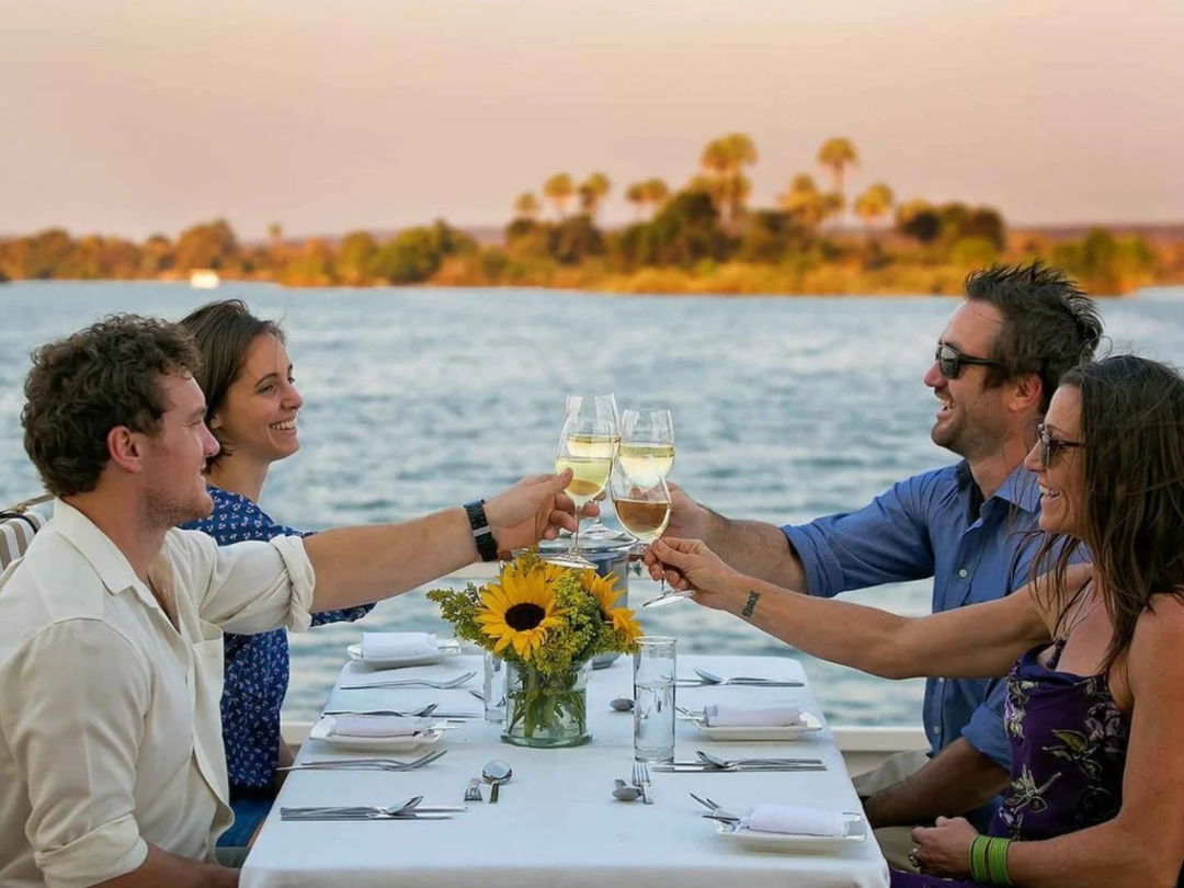 A romantic Zambezi boat cruise is a beautiful experience for couples enjoying a safari to Victoria Falls with Pieland Gorilla Safaris. As the boat moves gently along the Zambezi River, couples can relax together while watching the sunset, enjoying peaceful river scenery, and possibly spotting hippos, crocodiles, elephants, and colorful birdlife along the banks. The warm evening light creates a perfect setting for photographs, drinks, and quiet moments together. This relaxing cruise adds romance to a Victoria Falls holiday and combines perfectly with luxury accommodation, waterfall sightseeing, and wildlife activities for an unforgettable Southern African getaway.