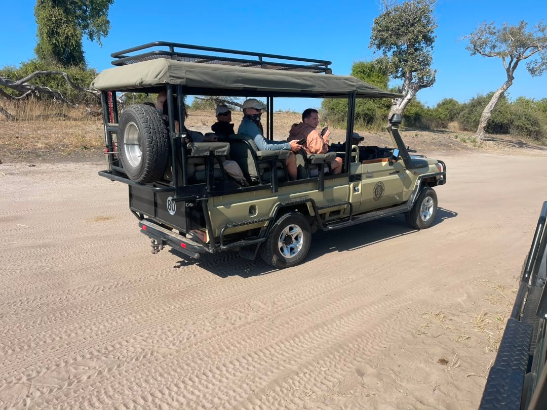 A small group of travelers enjoys an exciting game drive in Chobe National Park as part of a safari combined with Victoria Falls and organized by the Best Victoria Falls Safari Company. Traveling together in a comfortable safari vehicle, the group explores Chobe’s scenic landscapes while searching for elephants, buffaloes, giraffes, antelopes, lions, and other wildlife. The experience allows guests to share memorable sightings, take photographs, and learn about the park from a professional safari guide. Combining Victoria Falls and Chobe National Park creates a rewarding Southern African journey filled with wildlife, scenery, adventure, and unforgettable group experiences.