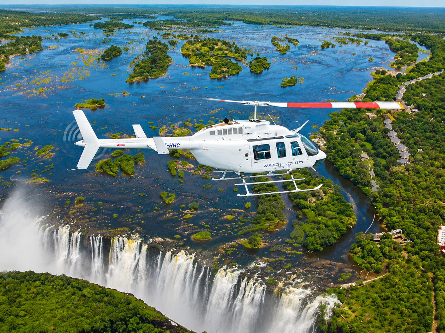 A helicopter experience over Victoria Falls offers an unforgettable aerial adventure above one of the world’s most spectacular natural wonders. As the helicopter rises above the Zambezi River, travellers enjoy breathtaking panoramic views of the mighty falls, endless rainforest, river channels, and surrounding landscapes. The famous “Flight of Angels” provides incredible opportunities to capture stunning photographs while witnessing the power and beauty of Victoria Falls from a unique perspective. With thrilling flight moments, spectacular scenery, and a bird’s-eye view of this UNESCO World Heritage Site, a helicopter tour creates memories that last a lifetime.