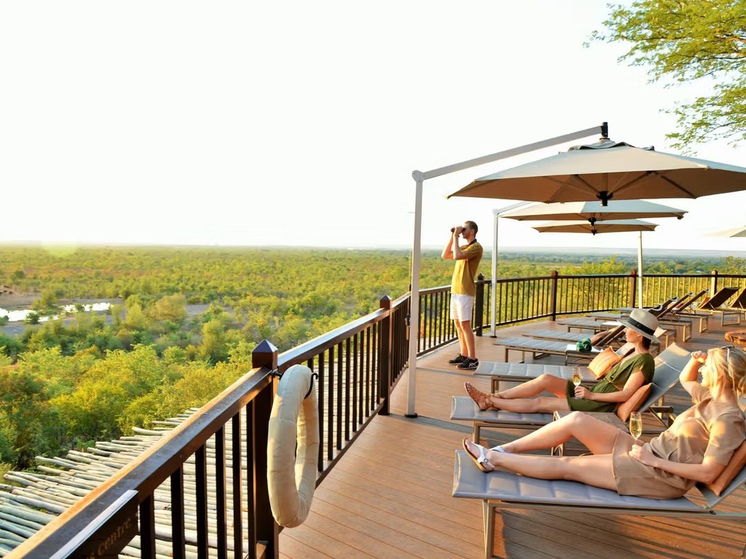 Victoria Falls Safari Lodge is one of the best family-friendly lodges in Victoria Falls for travelers combining a visit to the waterfall with a safari to Chobe National Park. The lodge offers comfortable accommodation, spacious surroundings, excellent dining, a swimming pool, and beautiful views across the surrounding wilderness. Families can relax between activities while enjoying the peaceful safari atmosphere and opportunities to observe wildlife around the nearby waterhole. Its location also makes it convenient for Victoria Falls excursions, Zambezi River activities, and onward road transfers toward Botswana. It is a comfortable and practical choice for families seeking both relaxation and adventure.