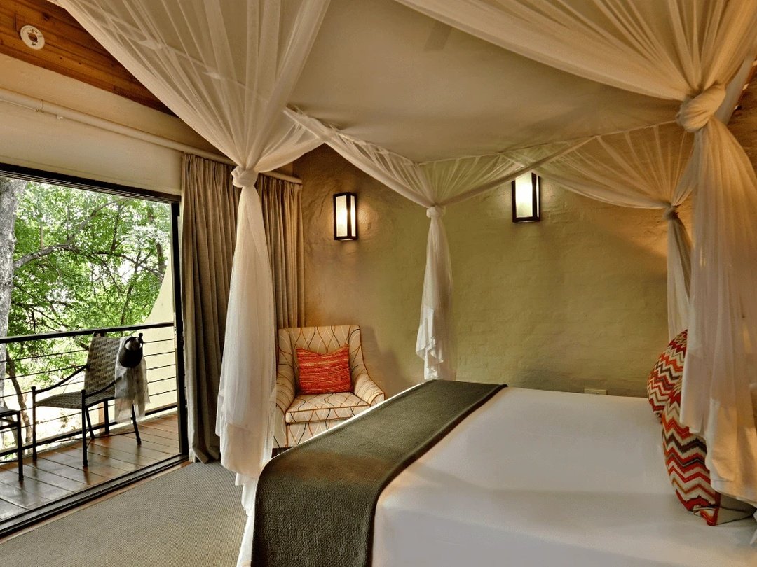 Victoria Falls Safari Suites is one of the best Victoria Falls accommodation choices for families seeking space, comfort, and a relaxed safari atmosphere. The suites are particularly suitable for parents traveling with children because they offer multi-bedroom layouts, comfortable living areas, and greater privacy than standard hotel rooms. Families can enjoy access to nearby dining, swimming facilities, wildlife surroundings, and convenient transfers to Victoria Falls attractions. The property also works well for longer stays and family safaris combining Victoria Falls with Chobe National Park. It is an excellent option for families wanting practical accommodation without giving up comfort or safari character.