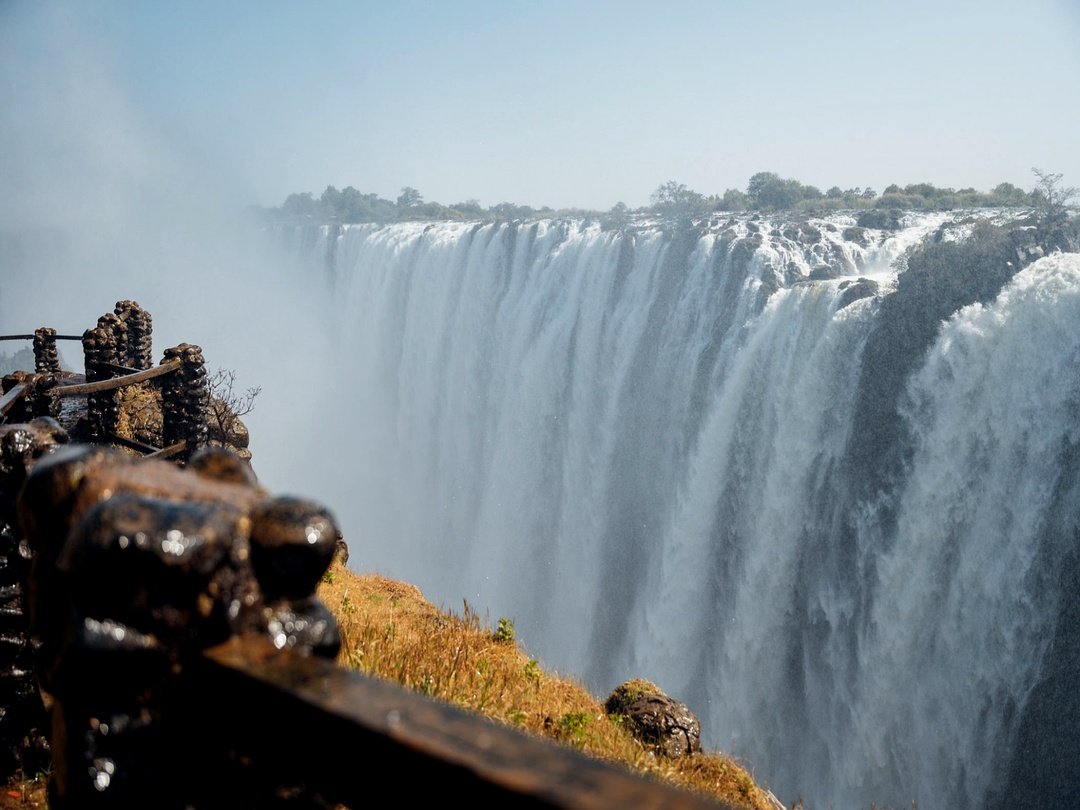 Victoria Falls is one of Africa’s most spectacular natural wonders, located on the mighty Zambezi River between Zimbabwe and Zambia. Known as “The Smoke That Thunders,” this magnificent waterfall creates a breathtaking curtain of water, mist, and rainbows as millions of litres plunge into the gorge below. Surrounded by lush rainforest and incredible wildlife, Victoria Falls offers unforgettable experiences including scenic viewpoints, sunset cruises, helicopter flights, and adventure activities, making it a must-visit destination for travellers exploring Africa.