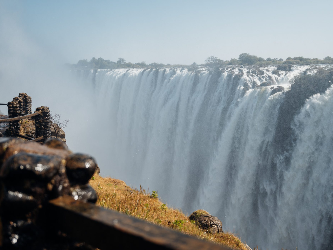 A Victoria Falls Safari Package with Pieland Gorilla Safaris can include a guided visit to the spectacular Victoria Falls, where travelers explore scenic viewpoints, rainforest paths and the dramatic Zambezi River as it plunges into Batoka Gorge. The experience allows guests to appreciate the immense power, mist and beauty of one of Africa’s most famous natural attractions while learning about its geology, seasonal water levels and surrounding environment. Pieland Gorilla Safaris can combine the falls visit with comfortable accommodation, airport transfers, a Zambezi sunset cruise, helicopter flights and wildlife extensions to Chobe or Hwange for a complete Southern Africa safari.