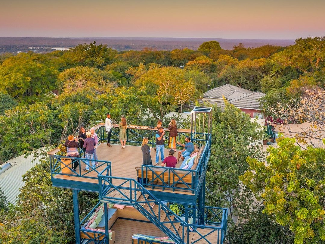 Shongwe Lookout is one of the best mid-range lodges in Victoria Falls for travelers seeking comfort, style, and a relaxed atmosphere. The lodge offers beautifully designed rooms, attractive gardens, a swimming pool, welcoming communal spaces, and its distinctive lookout tower with views across the surrounding area. Its convenient location allows guests to explore Victoria Falls, enjoy Zambezi River cruises, join adventure activities, and connect easily with onward safaris to Chobe National Park. Shongwe Lookout is especially suitable for couples, families, and independent travelers looking for comfortable accommodation with a boutique feel and convenient access to Victoria Falls attractions.