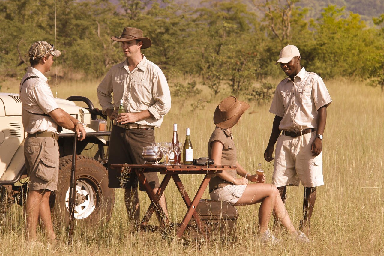 Travelers wearing the best safari apparel in Chobe National Park on a holiday organized by Pieland Gorilla Safaris stay comfortable while enjoying game drives and river safaris. Lightweight, breathable clothing in neutral colors such as khaki, beige, olive and brown is ideal for the warm daytime conditions. Long trousers, comfortable shirts, closed walking shoes, a wide-brimmed hat and sunglasses provide useful protection from sun, dust and insects. Early morning drives can be cooler, so carrying a light fleece or jacket is recommended. Pieland Gorilla Safaris helps travelers prepare properly for a comfortable and enjoyable Chobe safari experience.