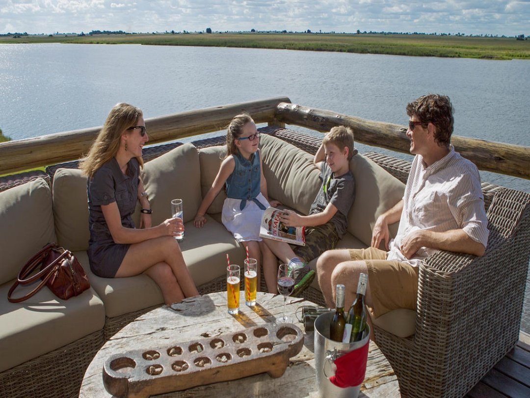 Family enjoying a safari experience in the Okavango Delta Botswana