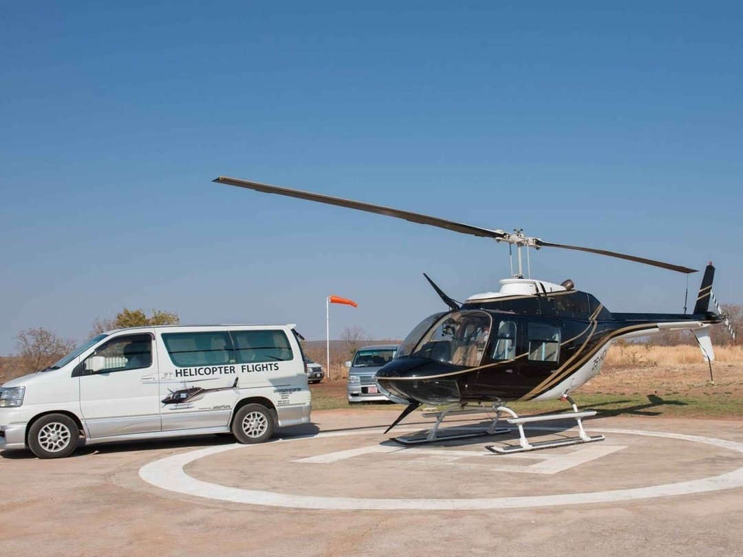 A helicopter used for private transfers, providing a comfortable and convenient way for travelers to reach Victoria Falls and nearby safari destinations.