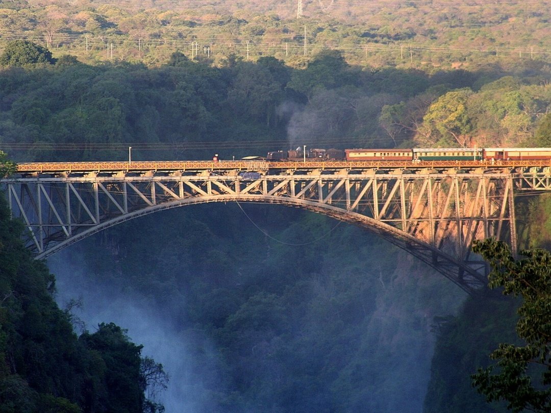 The Victoria Falls Bridge spanning the Zambezi River gorge, connecting Zambia and Zimbabwe near the spectacular Victoria Falls.