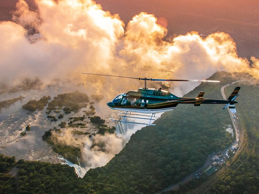 Victoria Falls helicopter tour offering breathtaking aerial views of the waterfall, Zambezi River, Batoka Gorge, and surrounding landscapes from above.