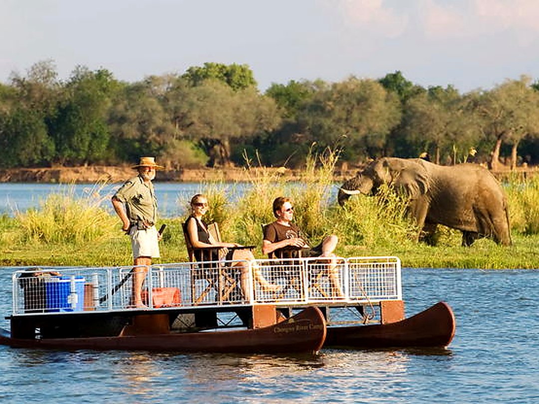 Tourists enjoying a wildlife safari in Zambezi National Park, Zimbabwe.