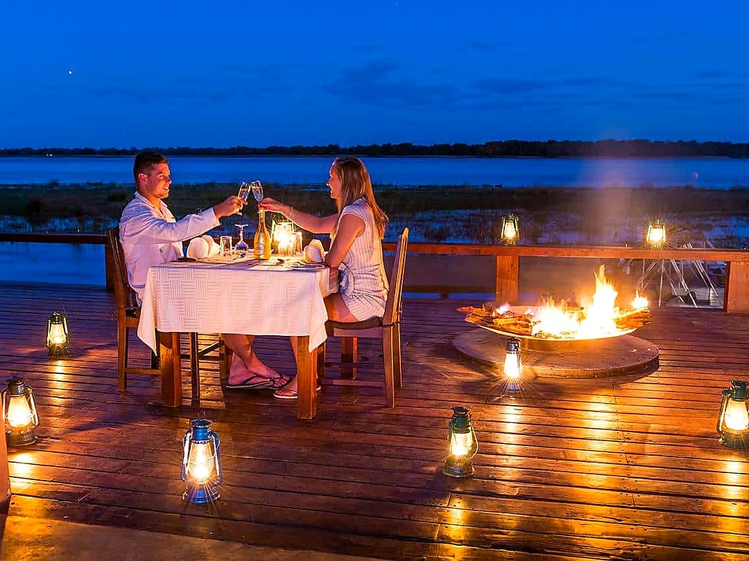 Honeymooners enjoying a romantic moment during a Zambezi National Park safari.
