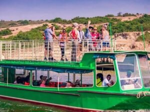 Travellers enjoying a boat safari on the Kazinga Channel in Queen Elizabeth National Park, Uganda