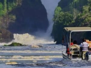 Safari boat cruising on the River Nile towards Murchison Falls in Uganda.