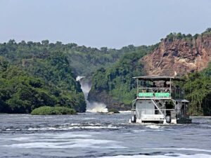 Safari boat cruising on the River Nile towards Murchison Falls in Uganda
