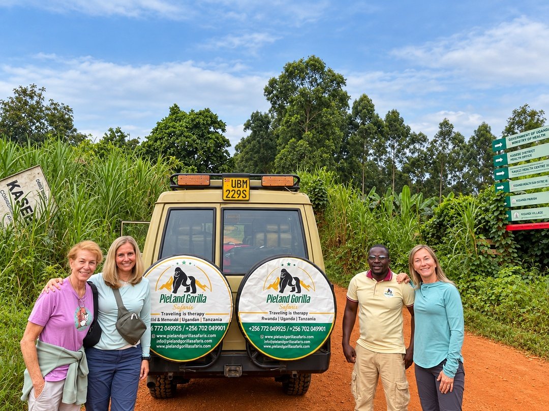 Solo travellers taking a group photo beside their shared safari vehicle during a Gorilla Group Joining Safari for Solo Travellers in Uganda.