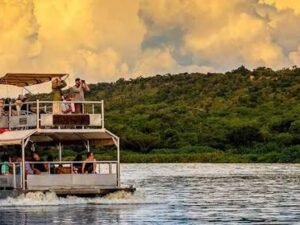 Travellers enjoying a scenic boat safari at Kazinga Channel